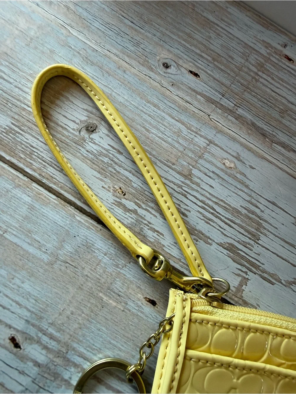 Coach wristlet Buttercup Yellow Signature Embossed Wristlet NWT